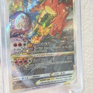 Pokemon Charizard VSTAR Card with Fiery Red and Gold Design
